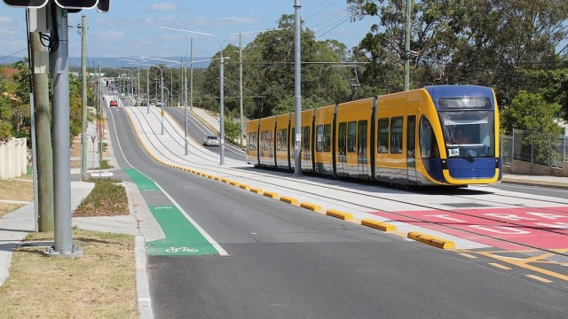 A modern tram, operating in a centre road reservation. The capacity of one road lane (about 1,200 pphpd) is increased to over 20,000 pphpd, using trams.