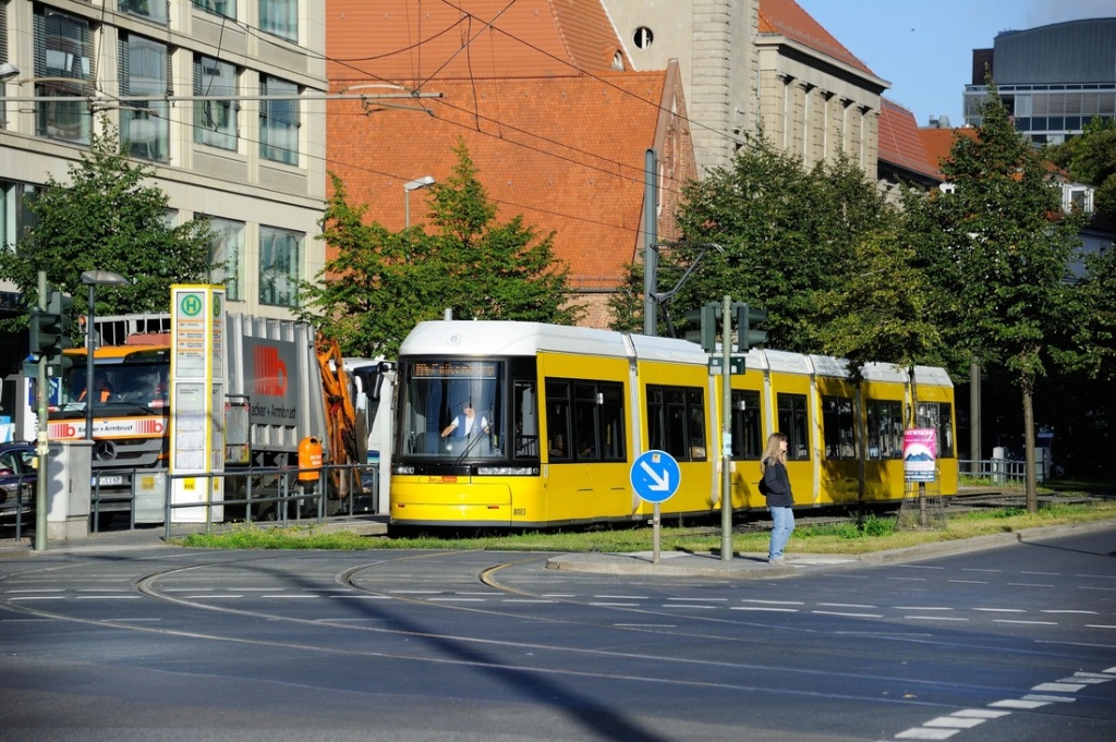 See how easily a Berlin tram transitions from being light rail on a dedicated right-of-way to a streetcar on a street. This flexibility of servcie has enabled simple trams to compete against very expensive light and heavy metros.